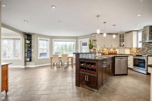 105 Lang Place, Okotoks, AB - Indoor Photo Showing Kitchen With Upgraded Kitchen