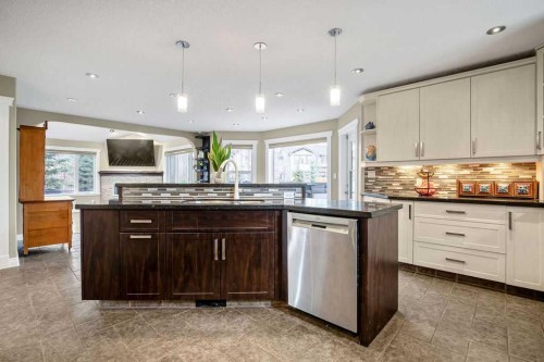 105 Lang Place, Okotoks, AB - Indoor Photo Showing Kitchen With Upgraded Kitchen