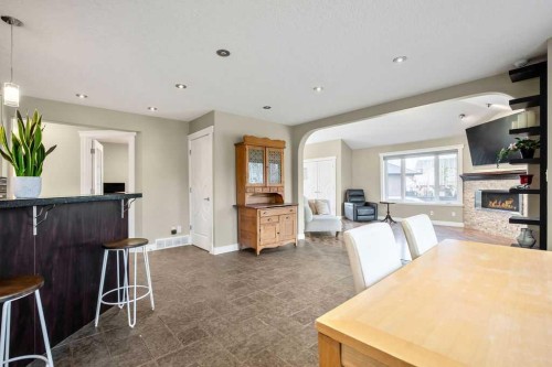 105 Lang Place, Okotoks, AB - Indoor With Fireplace
