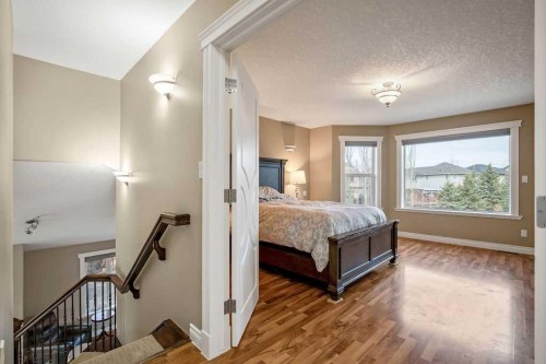 105 Lang Place, Okotoks, AB - Indoor Photo Showing Bedroom