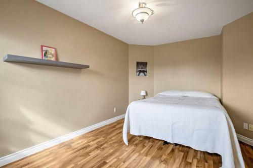 105 Lang Place, Okotoks, AB - Indoor Photo Showing Bedroom