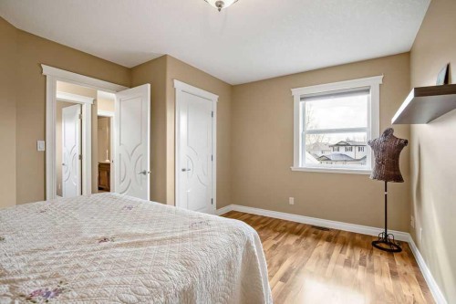 105 Lang Place, Okotoks, AB - Indoor Photo Showing Bedroom