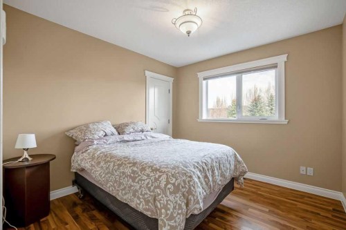 105 Lang Place, Okotoks, AB - Indoor Photo Showing Bedroom