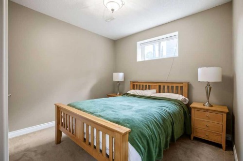 105 Lang Place, Okotoks, AB - Indoor Photo Showing Bedroom