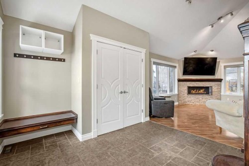 105 Lang Place, Okotoks, AB - Indoor With Fireplace