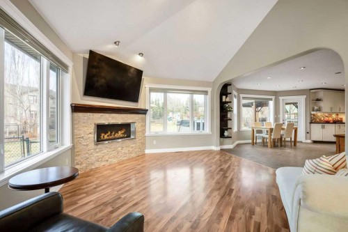 105 Lang Place, Okotoks, AB - Indoor Photo Showing Living Room With Fireplace