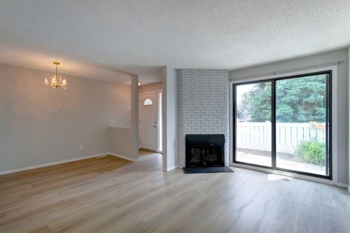 37-3015 51 Street Sw, Calgary, AB - Indoor Photo Showing Living Room With Fireplace