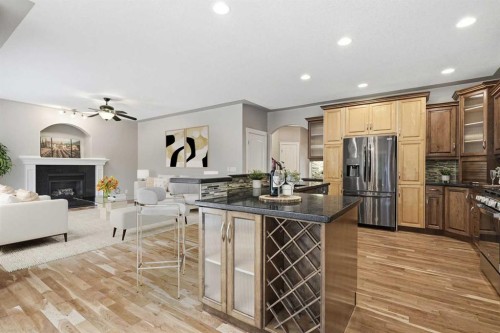 75 Royal Abbey Rise Nw, Calgary, AB - Indoor Photo Showing Kitchen With Fireplace