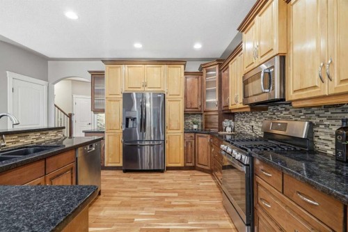 75 Royal Abbey Rise Nw, Calgary, AB - Indoor Photo Showing Kitchen With Double Sink With Upgraded Kitchen