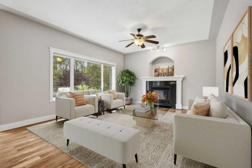 75 Royal Abbey Rise Nw, Calgary, AB - Indoor Photo Showing Living Room With Fireplace