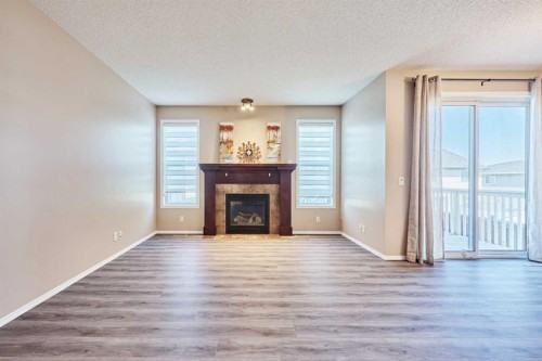 789 Panatella Boulevard Nw, Calgary, AB - Indoor Photo Showing Living Room With Fireplace