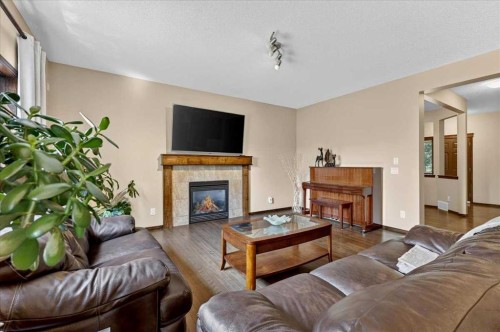277 Evermeadow Avenue Sw, Calgary, AB - Indoor Photo Showing Living Room With Fireplace