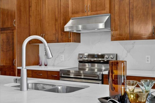 277 Evermeadow Avenue Sw, Calgary, AB - Indoor Photo Showing Kitchen With Double Sink