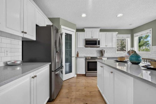 141 Douglas Glen Manor Se, Calgary, AB - Indoor Photo Showing Kitchen With Stainless Steel Kitchen With Upgraded Kitchen