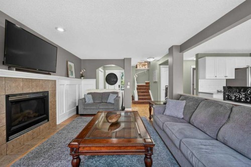 141 Douglas Glen Manor Se, Calgary, AB - Indoor Photo Showing Living Room With Fireplace