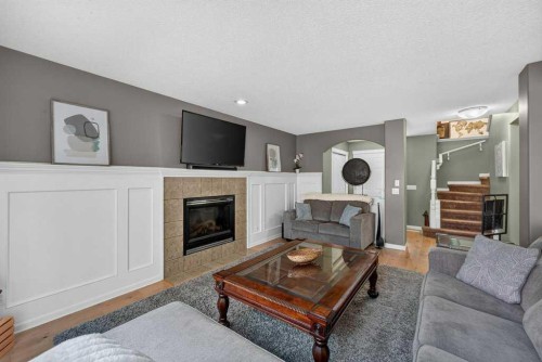 141 Douglas Glen Manor Se, Calgary, AB - Indoor Photo Showing Living Room With Fireplace