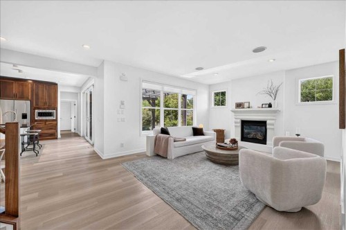 4 Quarry Landing Se, Calgary, AB - Indoor Photo Showing Living Room With Fireplace