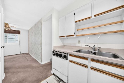 6437 Coach Hill Road Sw, Calgary, AB - Indoor Photo Showing Kitchen With Double Sink