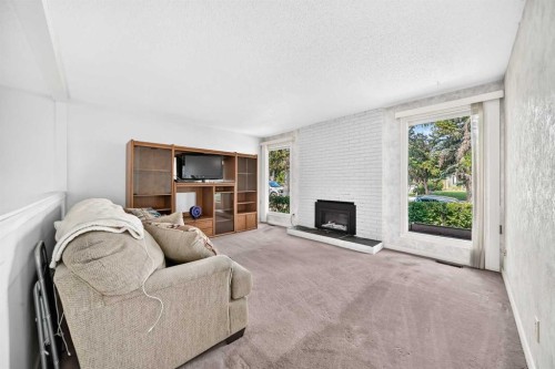6437 Coach Hill Road Sw, Calgary, AB - Indoor Photo Showing Other Room With Fireplace