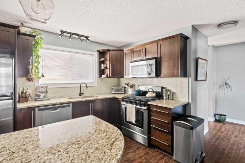 7-1603 Mcgonigal Drive Ne, Calgary, AB - Indoor Photo Showing Kitchen With Stainless Steel Kitchen With Upgraded Kitchen