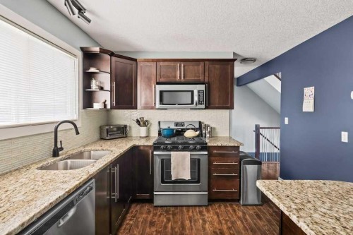 7-1603 Mcgonigal Drive Ne, Calgary, AB - Indoor Photo Showing Kitchen With Stainless Steel Kitchen With Double Sink With Upgraded Kitchen