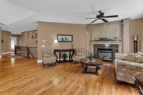 9 Tanner Close Se, Airdrie, AB - Indoor Photo Showing Living Room With Fireplace