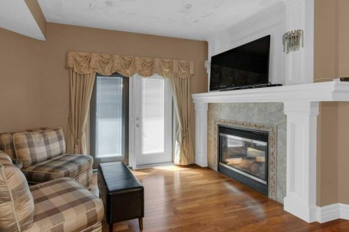 9 Tanner Close Se, Airdrie, AB - Indoor Photo Showing Living Room With Fireplace