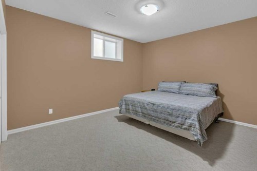 9 Tanner Close Se, Airdrie, AB - Indoor Photo Showing Bedroom