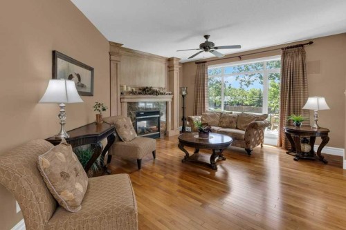 9 Tanner Close Se, Airdrie, AB - Indoor Photo Showing Living Room With Fireplace