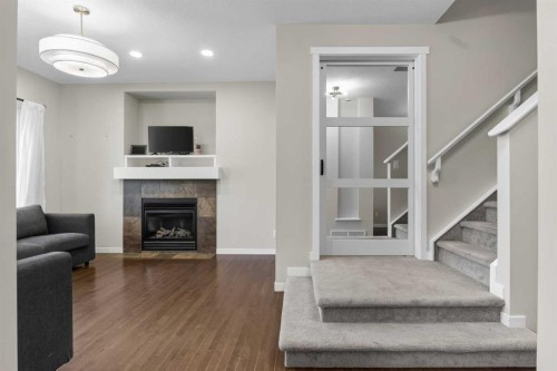 213 Mahogany Heights Se, Calgary, AB - Indoor Photo Showing Living Room With Fireplace