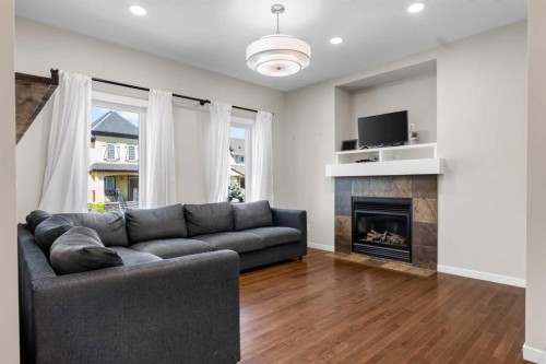 213 Mahogany Heights Se, Calgary, AB - Indoor Photo Showing Living Room With Fireplace