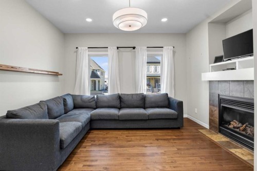 213 Mahogany Heights Se, Calgary, AB - Indoor Photo Showing Living Room With Fireplace