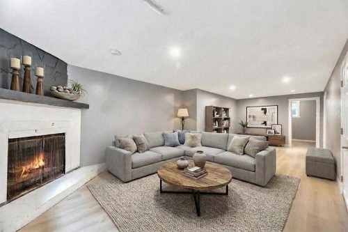 4819 Memorial Drive Se, Calgary, AB - Indoor Photo Showing Living Room With Fireplace