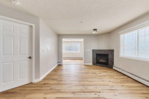 106-126 14 Avenue Sw, Calgary, AB - Indoor Photo Showing Living Room With Fireplace