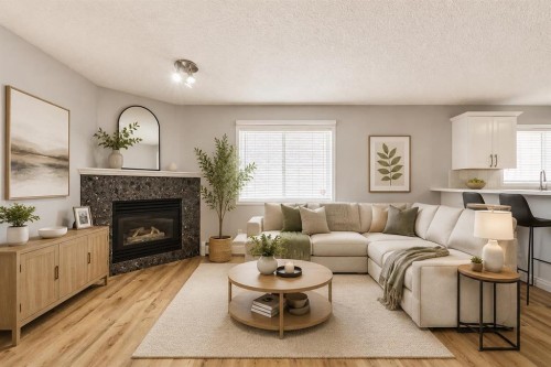 106-126 14 Avenue Sw, Calgary, AB - Indoor Photo Showing Living Room With Fireplace
