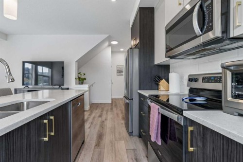 103 Spring Creek Common Sw, Calgary, AB - Indoor Photo Showing Kitchen With Double Sink With Upgraded Kitchen