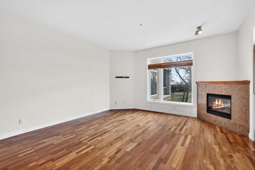 7304-14 Hemlock Crescent Sw, Calgary, AB - Indoor Photo Showing Living Room With Fireplace