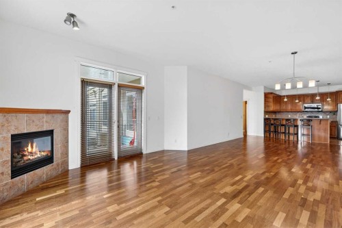 7304-14 Hemlock Crescent Sw, Calgary, AB - Indoor Photo Showing Living Room With Fireplace