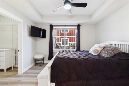 1-67 West Coach Manor Sw, Calgary, AB - Indoor Photo Showing Bedroom