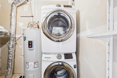 1-67 West Coach Manor Sw, Calgary, AB - Indoor Photo Showing Laundry Room