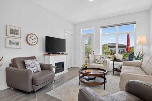 318 Marina Cove Se, Calgary, AB - Indoor Photo Showing Living Room With Fireplace