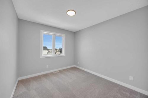 10 Versant Path Sw, Calgary, AB - Indoor Photo Showing Other Room