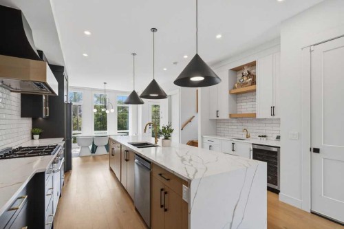 136 10 Avenue Nw, Calgary, AB - Indoor Photo Showing Kitchen With Double Sink With Upgraded Kitchen