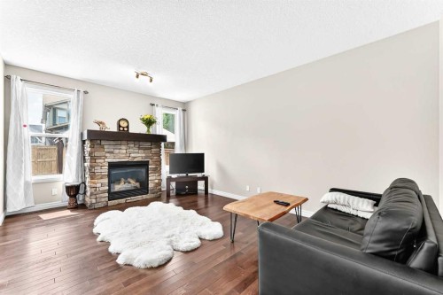 456 Mahogany Boulevard Se, Calgary, AB - Indoor Photo Showing Living Room With Fireplace