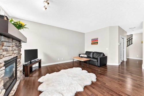 456 Mahogany Boulevard Se, Calgary, AB - Indoor Photo Showing Living Room With Fireplace