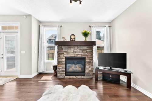 456 Mahogany Boulevard Se, Calgary, AB - Indoor Photo Showing Living Room With Fireplace