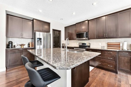 456 Mahogany Boulevard Se, Calgary, AB - Indoor Photo Showing Kitchen With Double Sink With Upgraded Kitchen
