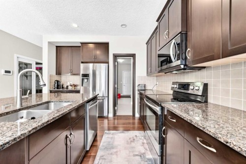 456 Mahogany Boulevard Se, Calgary, AB - Indoor Photo Showing Kitchen With Double Sink With Upgraded Kitchen