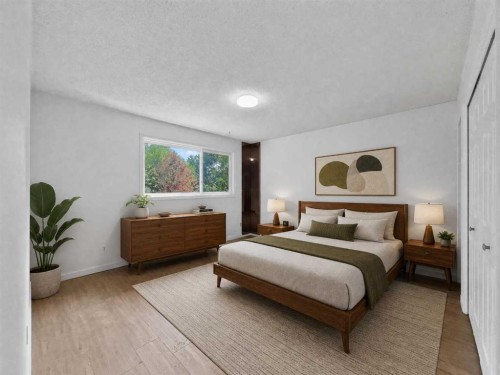 207 Deer Ridge Way Se, Calgary, AB - Indoor Photo Showing Bedroom