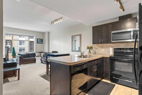 502-1410 1 Street Se, Calgary, AB - Indoor Photo Showing Kitchen With Double Sink